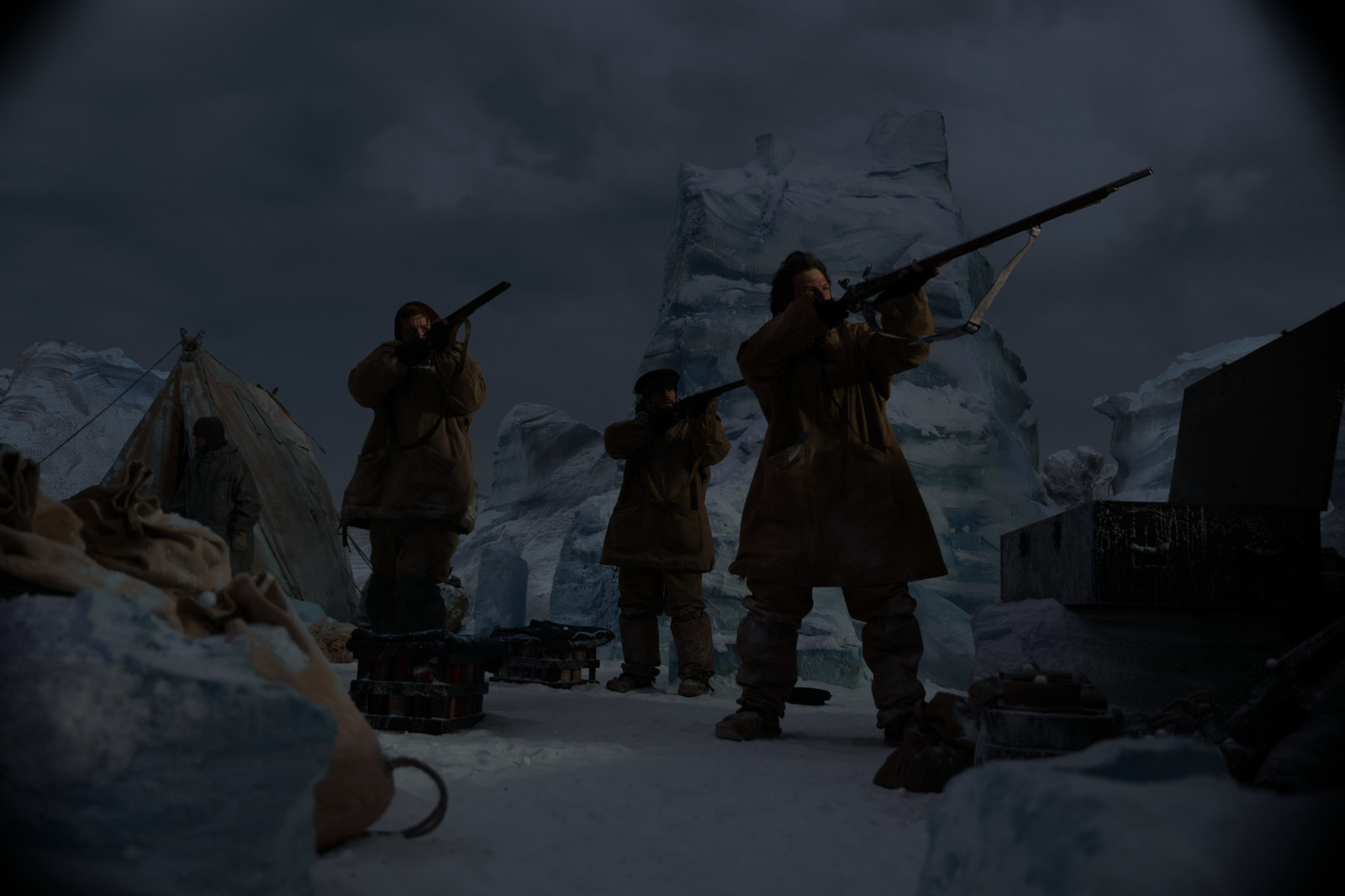 a group of people with guns standing in the snow