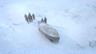 a group of people standing around a boat in the snow