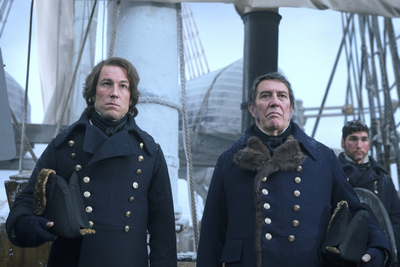 a group of men standing next to each other on a boat