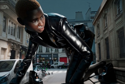 a woman in a black leather outfit leaning on a car