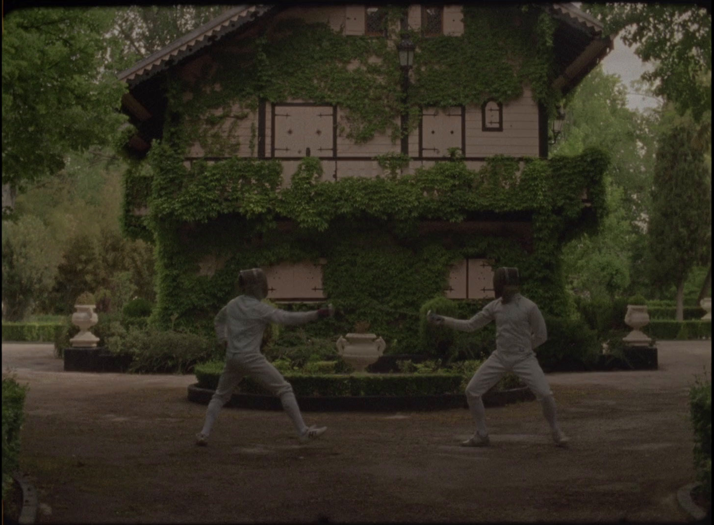 a couple of men standing in front of a house