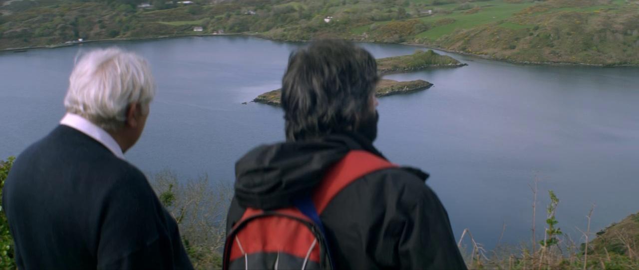 a couple of people that are looking at some water