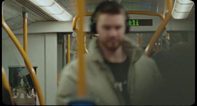 a blurry photo of a man on a bus