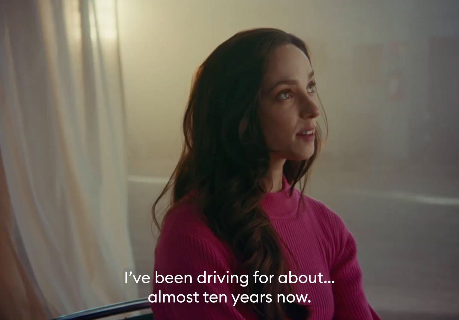 a woman sitting in a chair with a quote on it