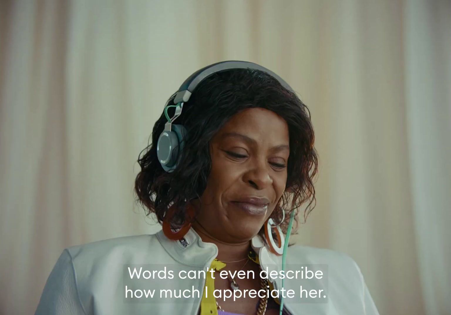 a woman wearing headphones with a quote on it