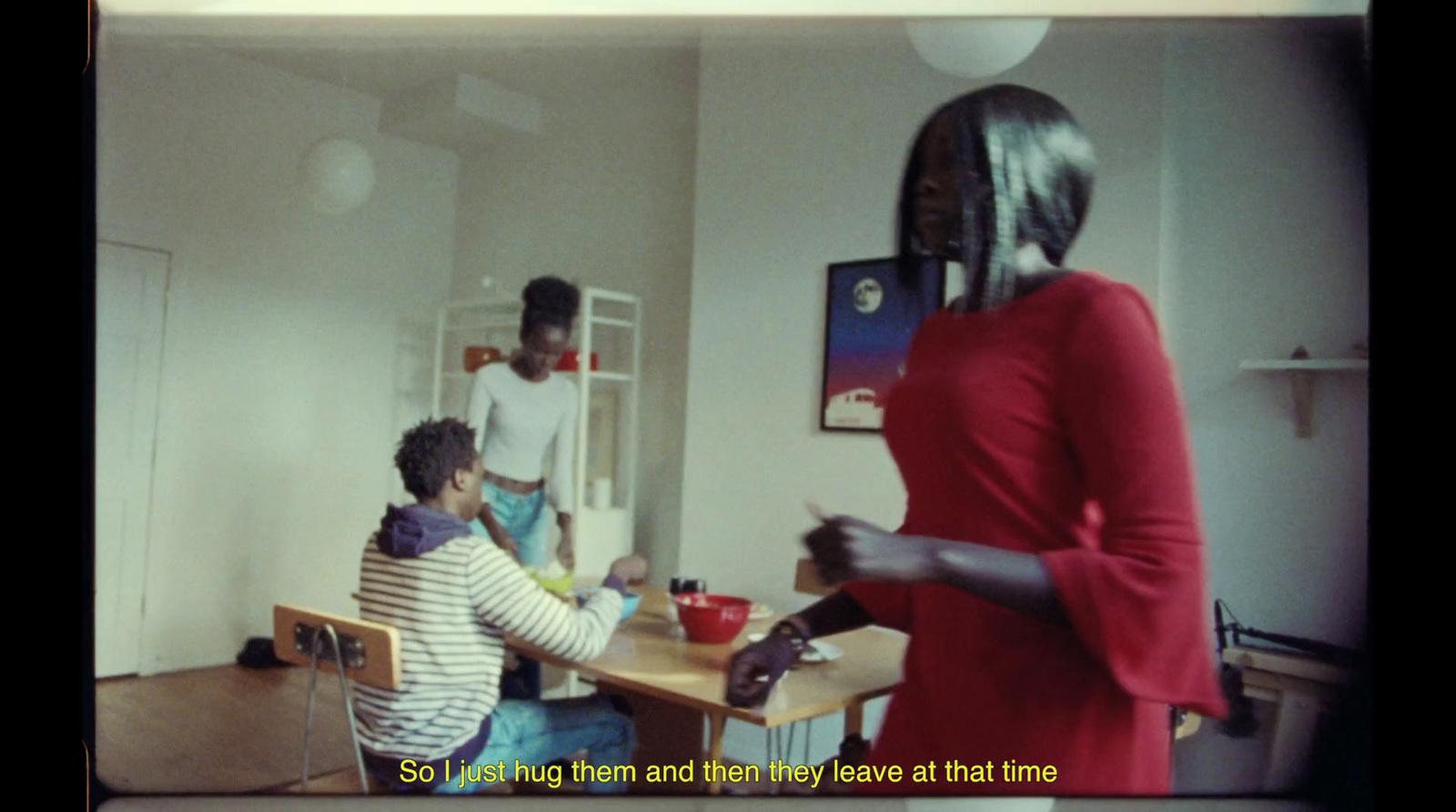 a woman standing in front of a table in a room