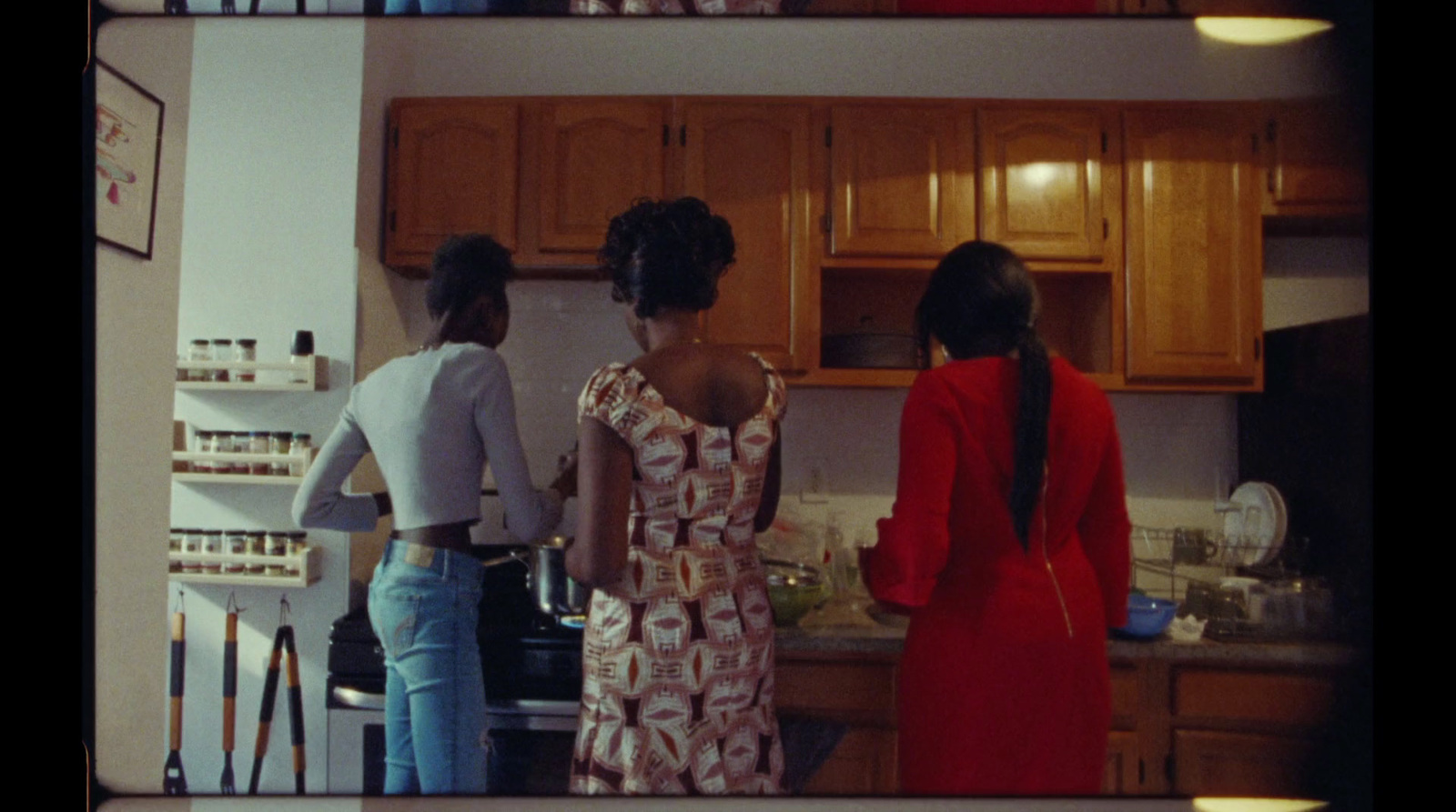 a group of women standing in a kitchen