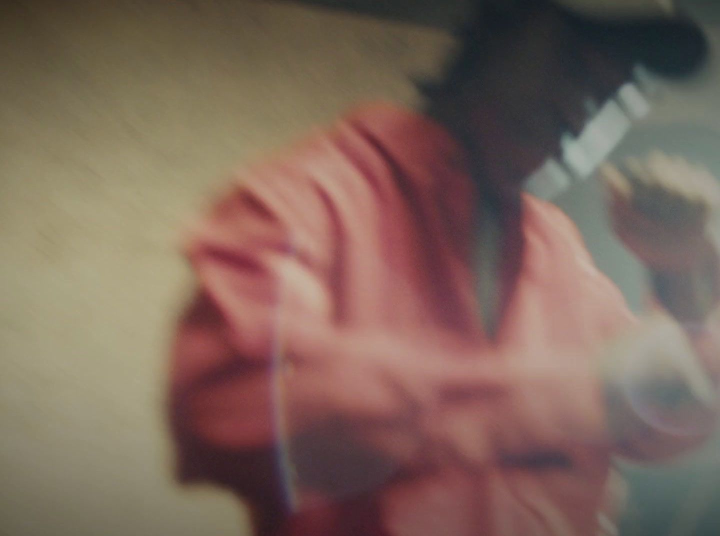 a blurry image of a man holding a baseball bat