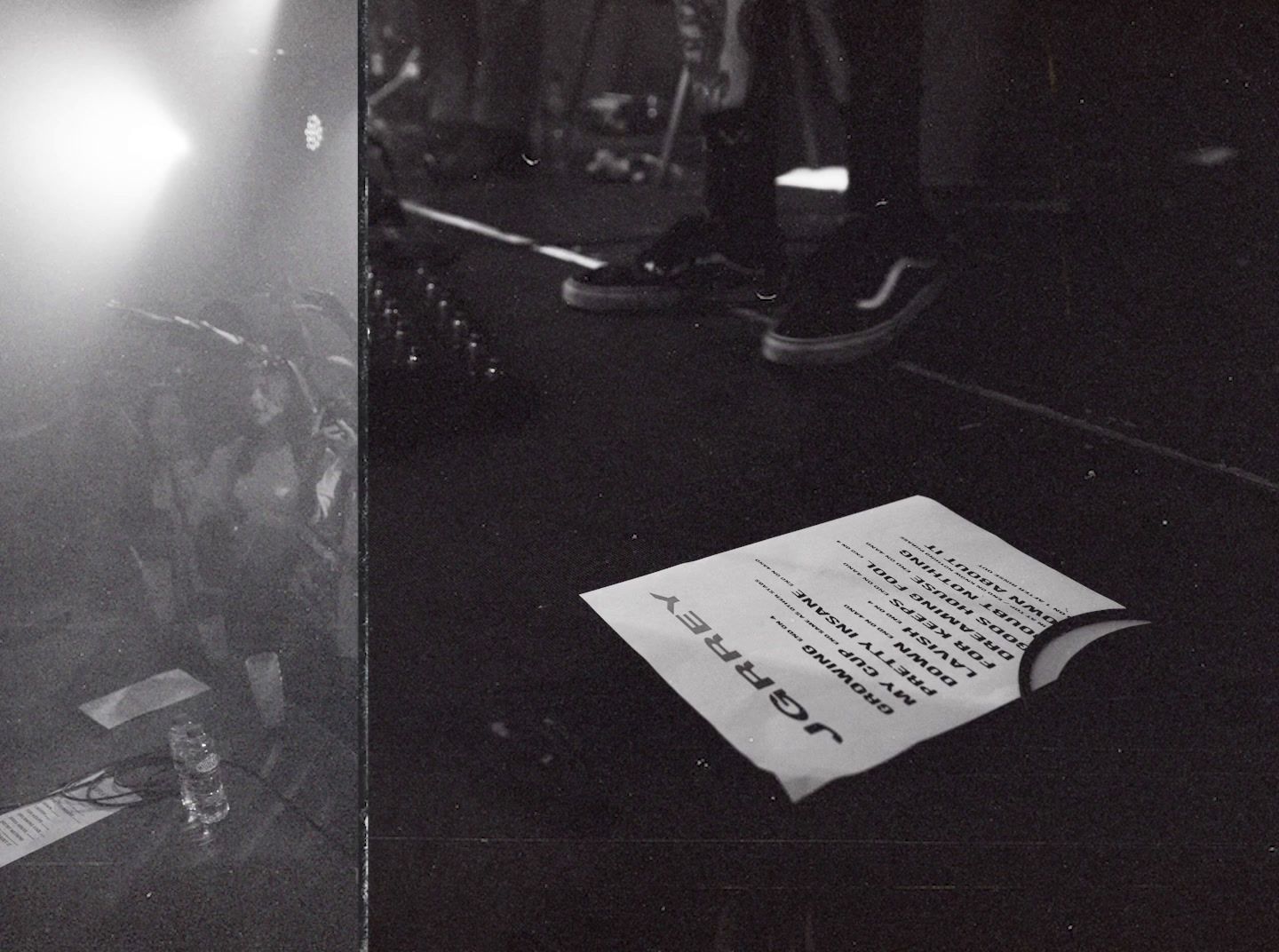 a black and white photo of a book on a stage