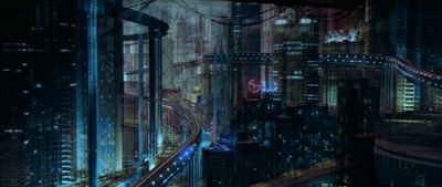 a futuristic city at night with a lot of lights