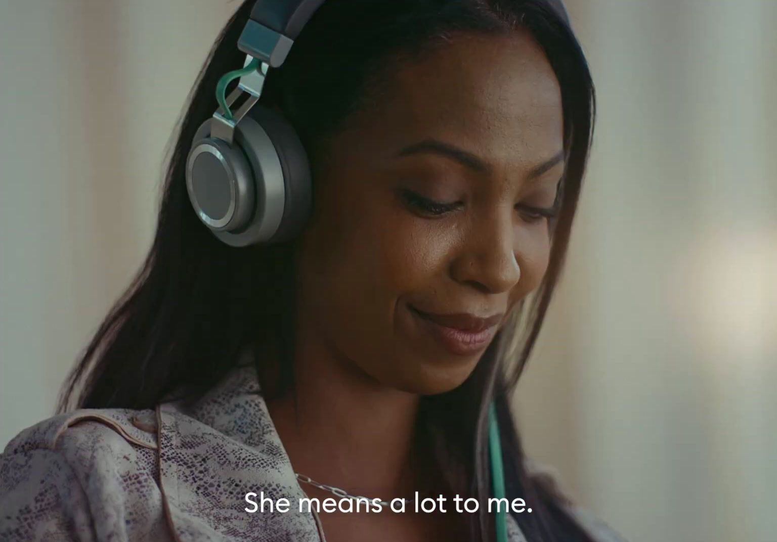 a woman wearing headphones with a message on it