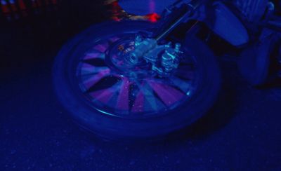 a motorcycle wheel with a blue light on it