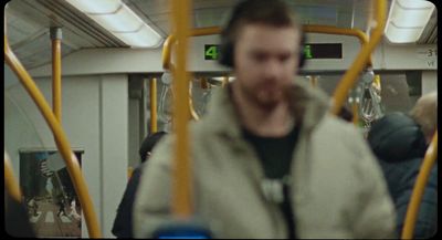 a blurry photo of a man on a bus