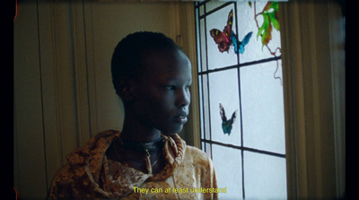 a man standing in front of a stained glass window