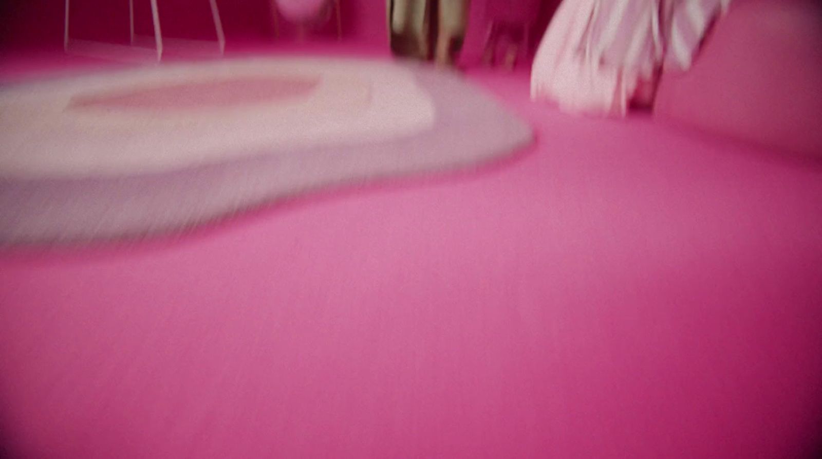 a room with a pink floor and pink walls