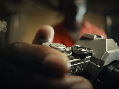 a person holding a camera in their hand