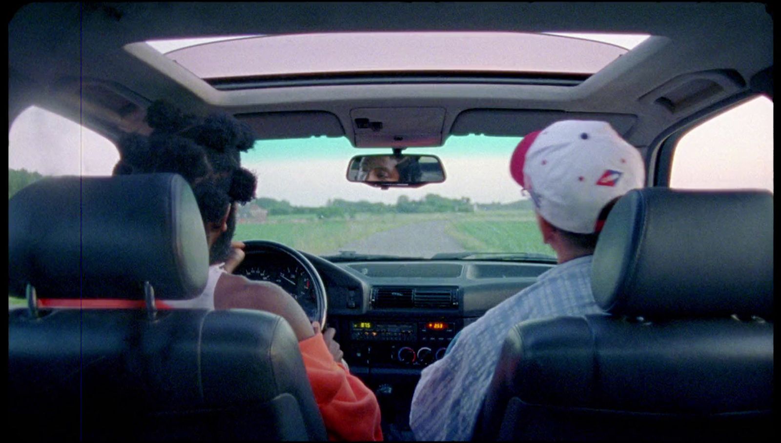 a couple of people that are sitting in a car