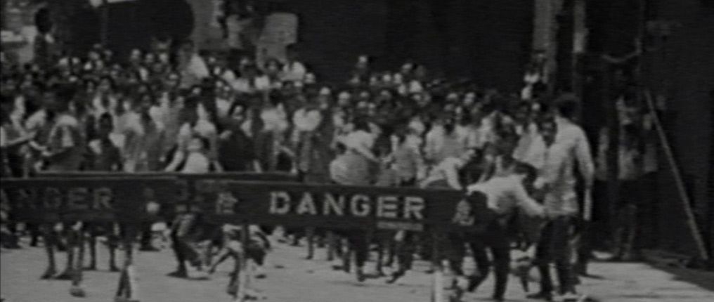 a crowd of people walking down a street