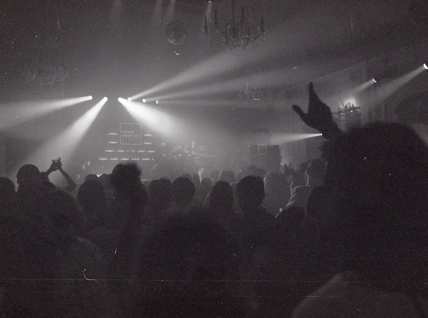 a black and white photo of a crowd at a concert