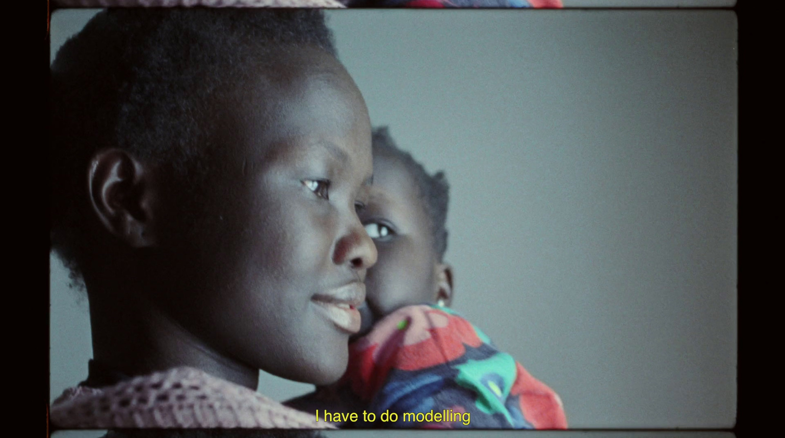 a woman holding a small child in her arms