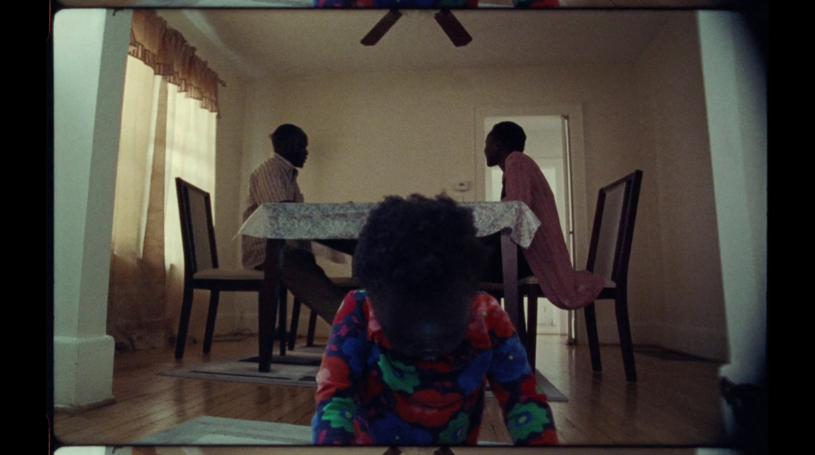 a person sitting at a table in a room