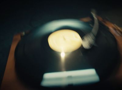 a candle that is on top of a record