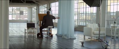 a person sitting in a chair in a room