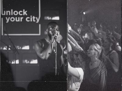 a black and white photo of a man singing into a microphone