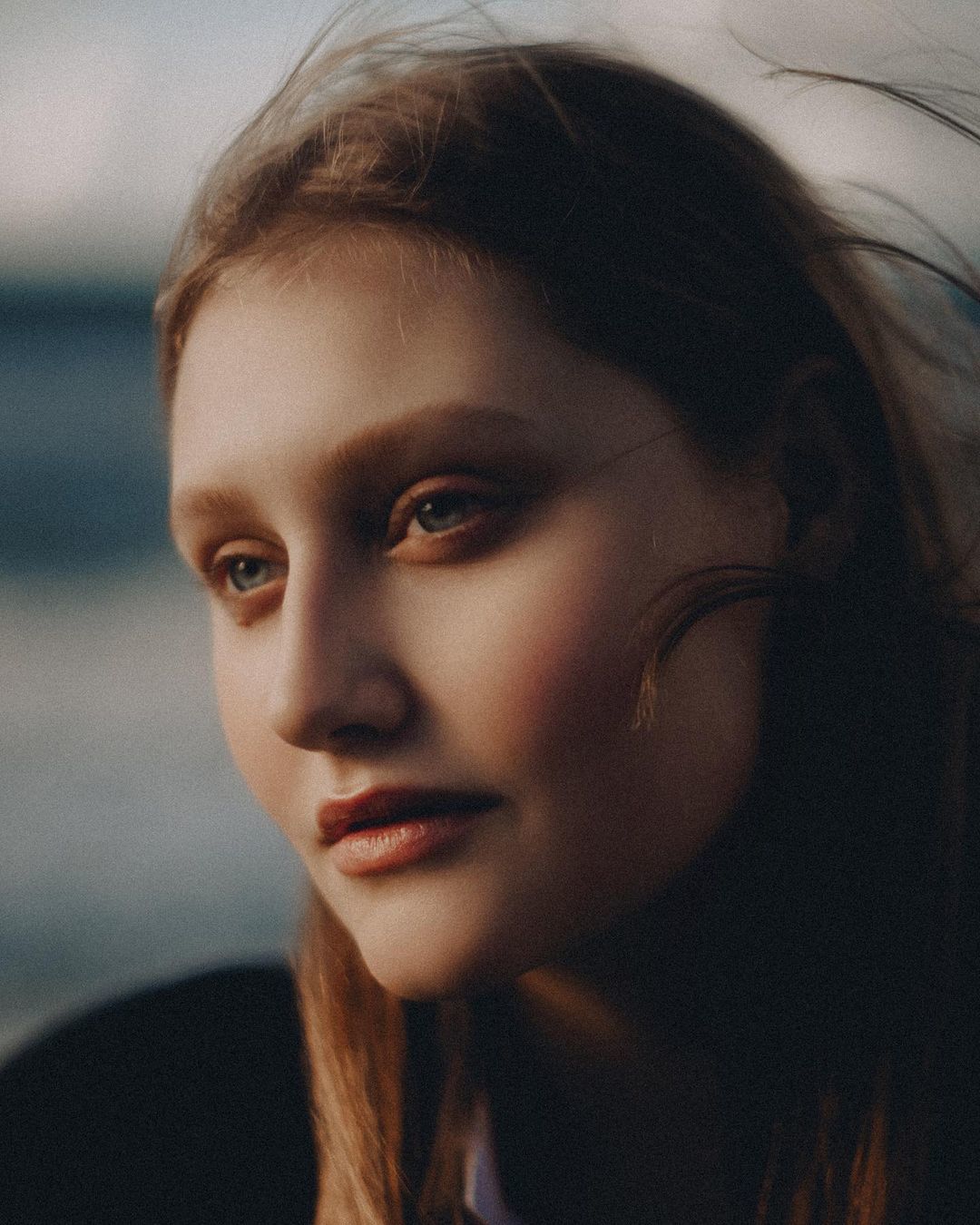 a close up of a person with long hair