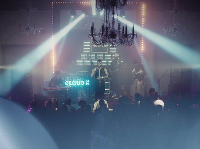 a group of people standing on top of a stage