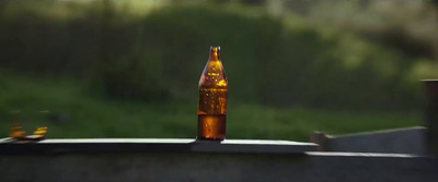 a beer bottle sitting on top of a table