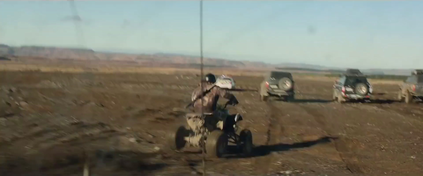 a man riding a dirt bike on top of a dirt field