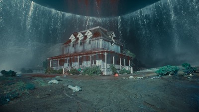 a house in the middle of a large waterfall