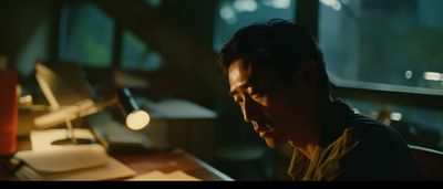 a man sitting at a desk in front of a computer