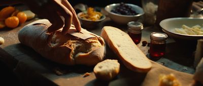 a loaf of bread sitting on top of a wooden cutting board