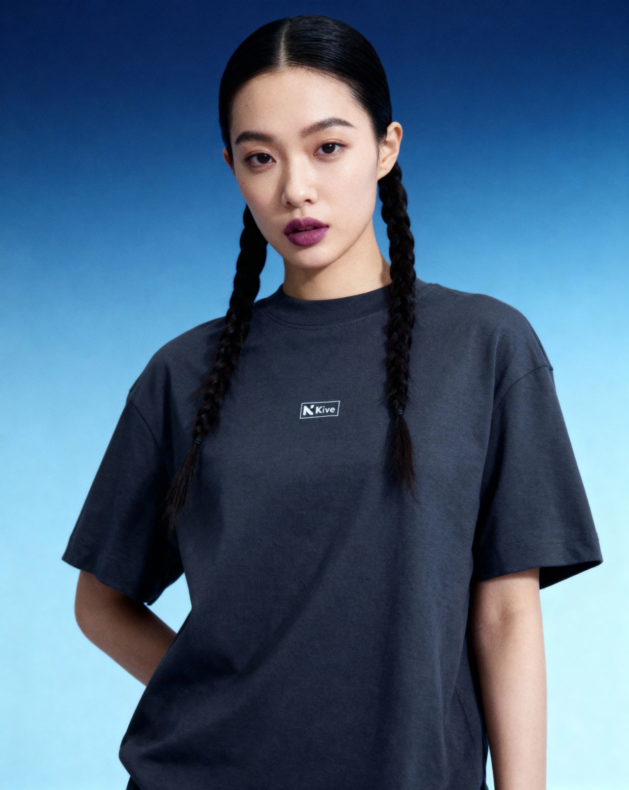 a woman with long hair wearing a black t - shirt - AI Image | Kive.ai