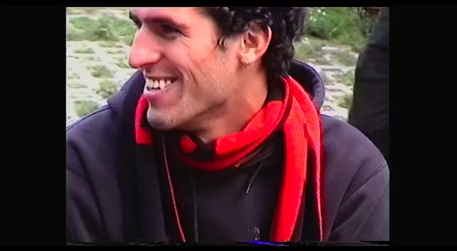 a man with a red scarf around his neck