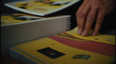 a person touching a book on top of a table