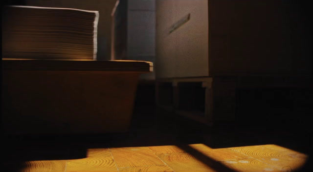 a stack of papers sitting on top of a wooden floor