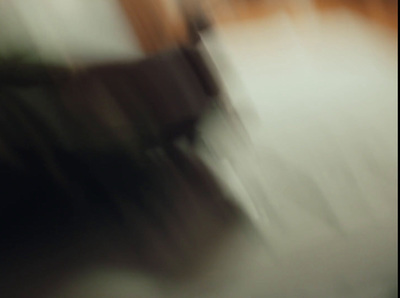 a blurry photo of a chair in a room