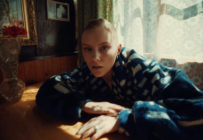 a woman laying on a table in a room