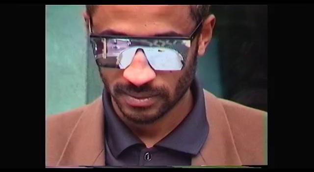 a man wearing sunglasses making a funny face