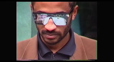 a man wearing sunglasses making a funny face