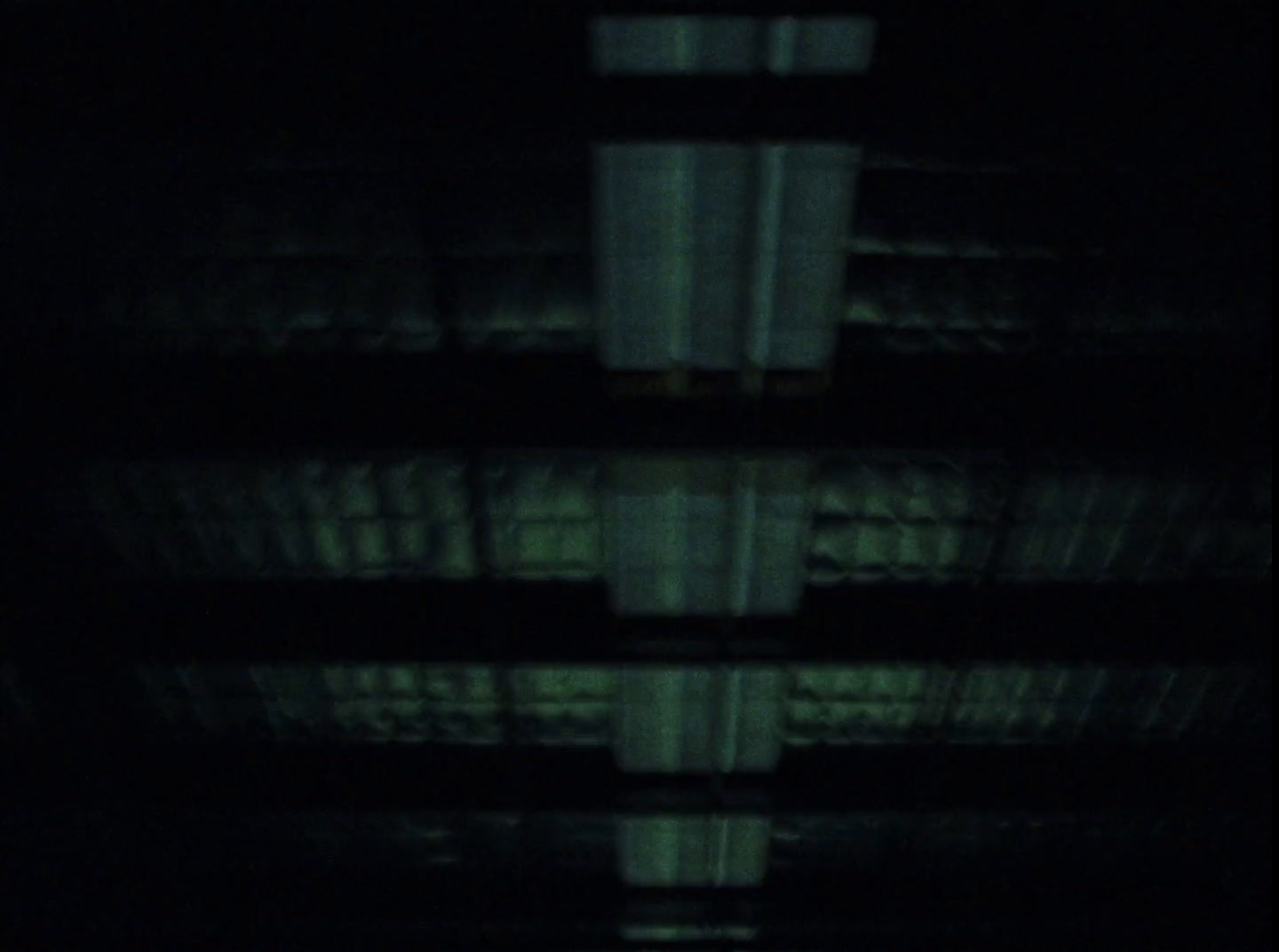 a blurry image of a building in the dark