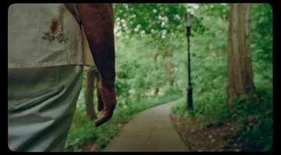 a person walking down a path in the woods