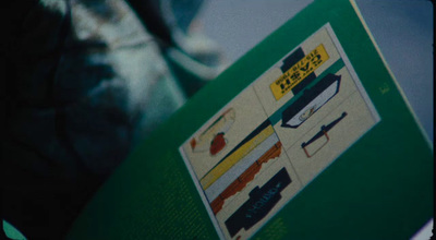 a close up of a book with a picture of guns on it