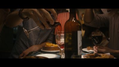 a group of people sitting around a dinner table