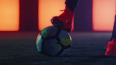 a soccer ball sitting on top of a field