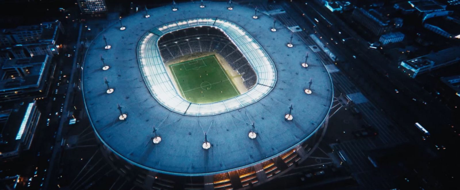 an aerial view of a soccer stadium at night