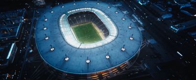 an aerial view of a soccer stadium at night